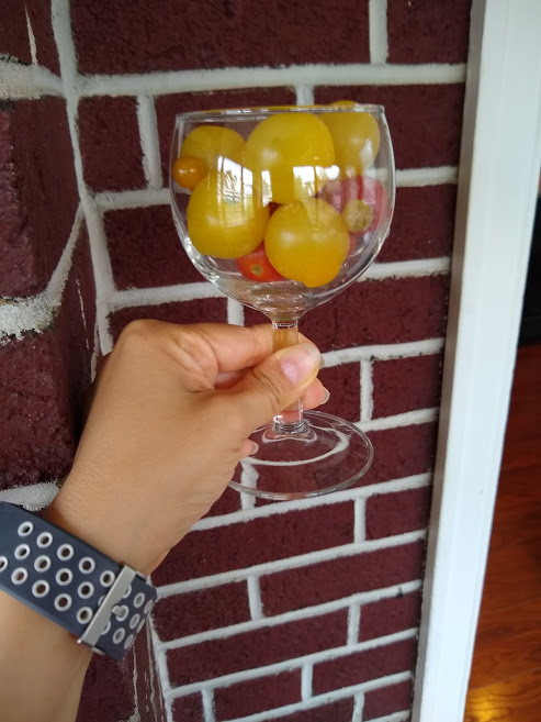 photo of cherry tomatoes in a wine glass